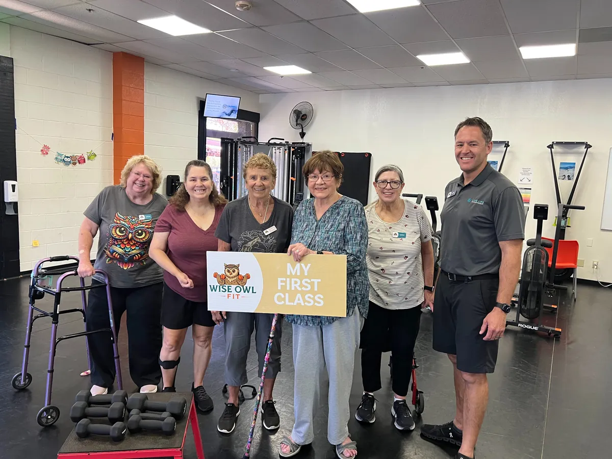 New members celebrating their first class at Wise Owl Fit