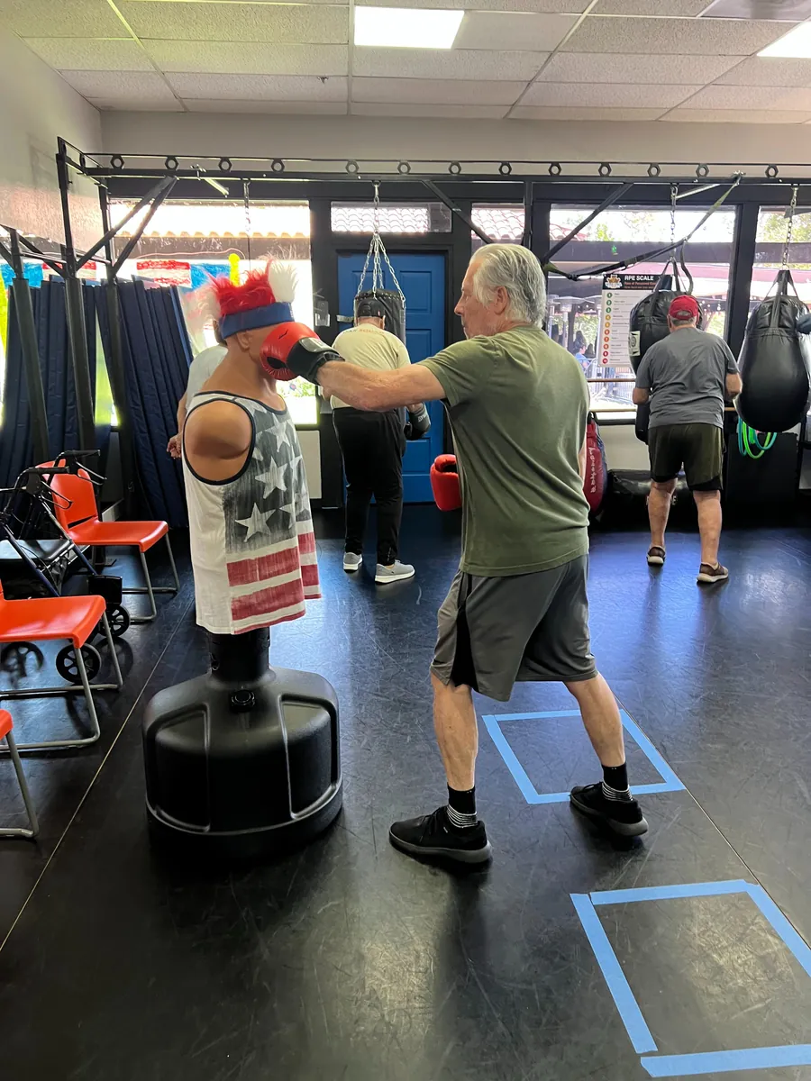 A Rock Steady boxer throwing a punch during class