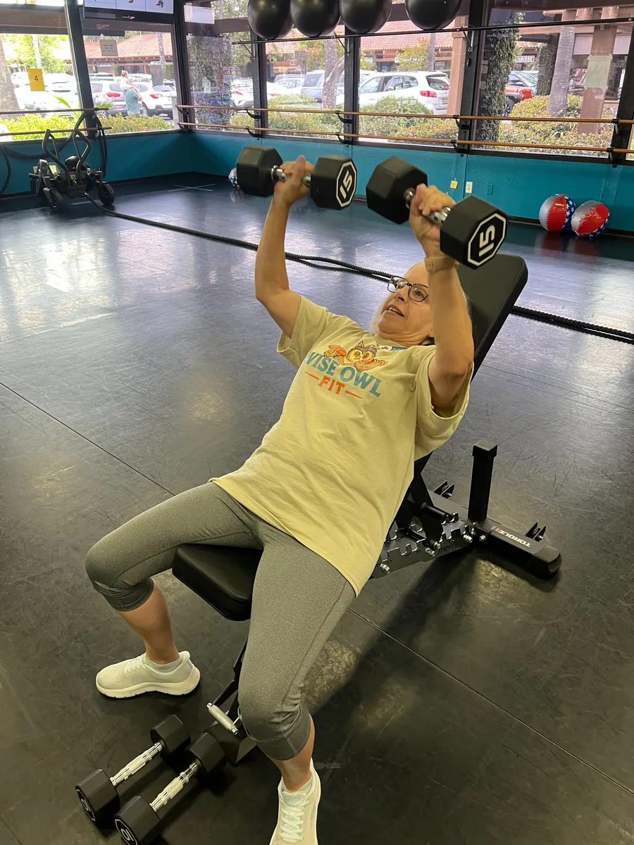 Incline dumbbell press during a Hoot Camp class