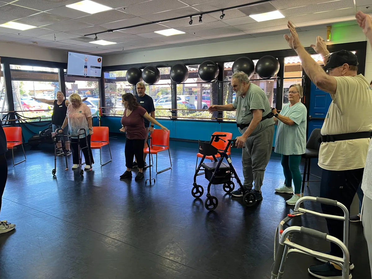 A Track 3 (Adaptive) class at Wise Owl Fit — members and coaches training together