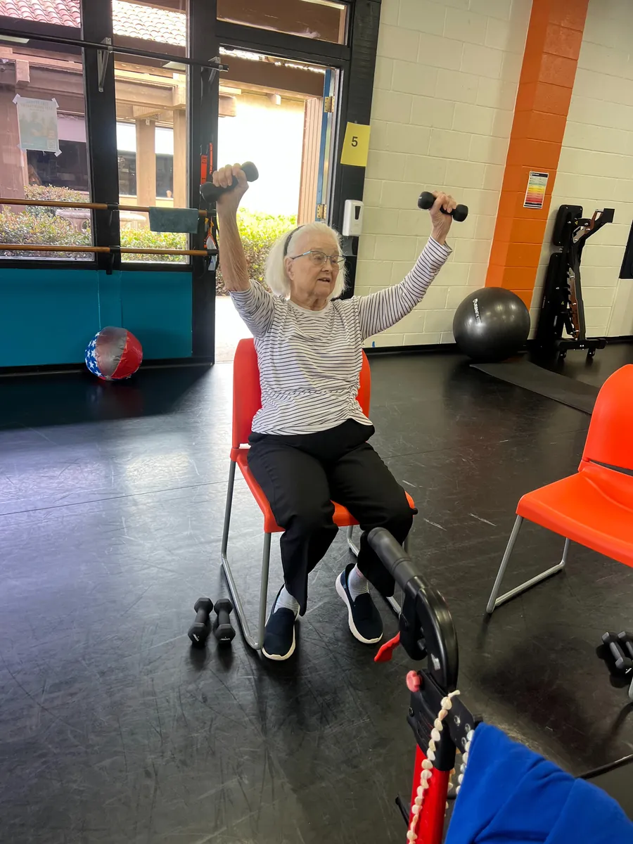 Seated strength work in a Track 3 class at Wise Owl Fit